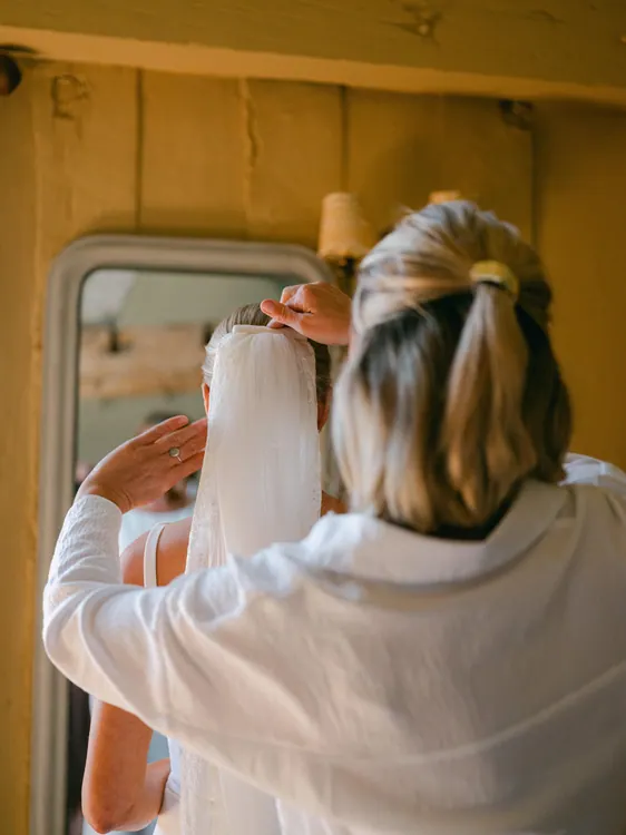 Charlotte finalising the veil placement